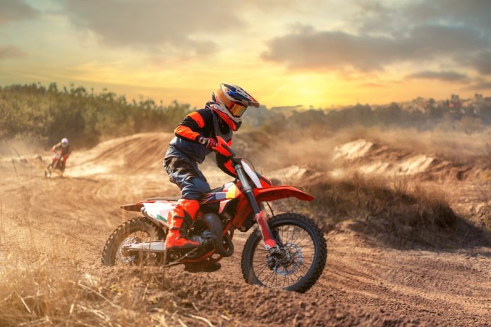 Enduro,Bike,Rider,Driving,Off,Road,Bike,On,Sunset,Background.